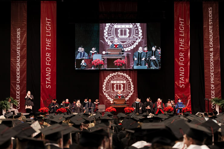 SNU Graduates Listen as University President, Dr. Keith Newman, Speaks
