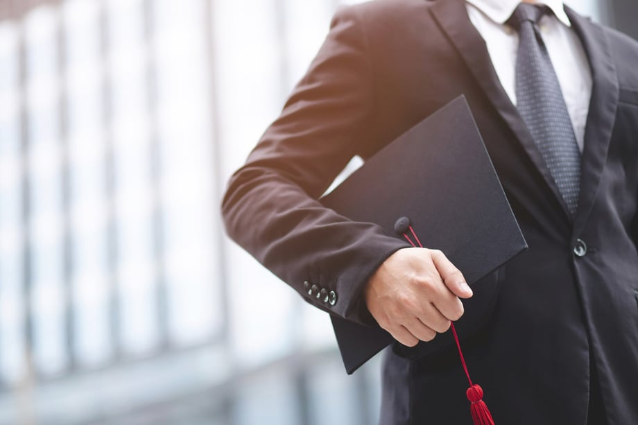 Man-using-graduate-degree-to-climb-the-corporate-ladder