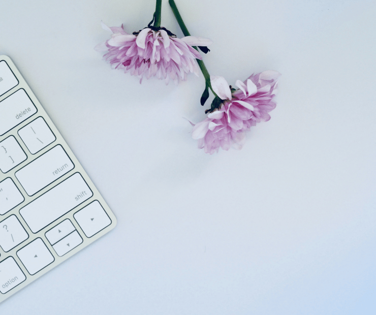 flowers laying next to keyboard