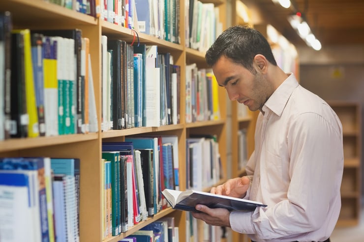 Adult student studying in a library