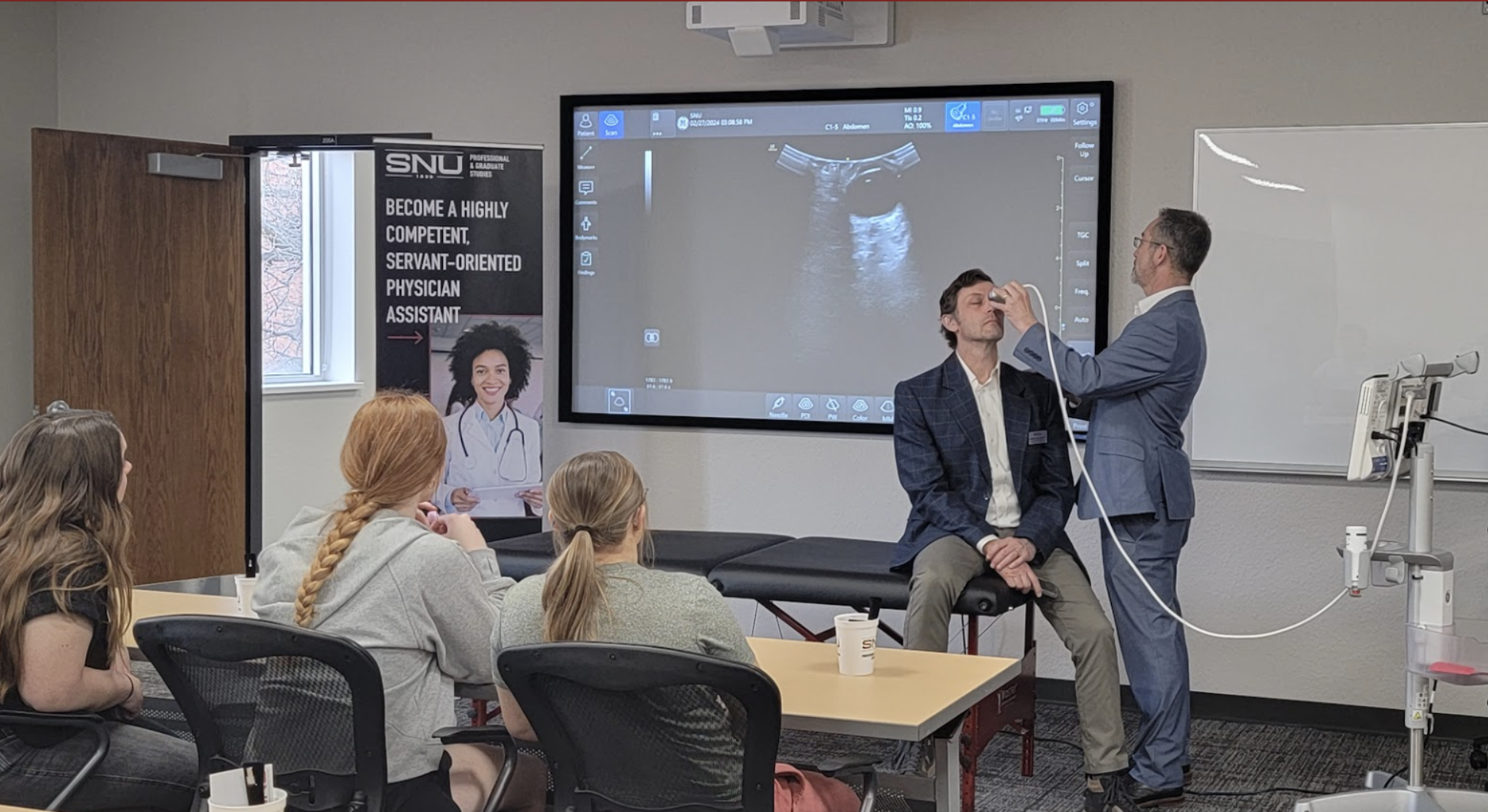 Dr. Mark Moran demonstrates use of an ultrasound.