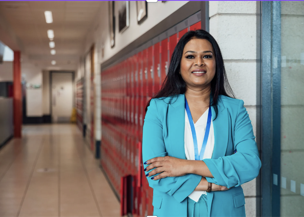 Teacher in hallway of school