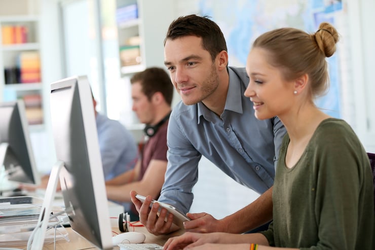 Man and Woman Working at Computer