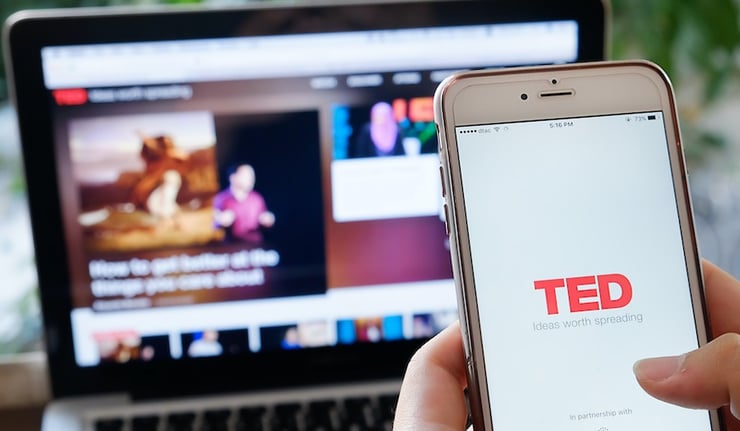 A hand holding Apple iPhone 6 plus with shows icon TED talk application,TED talk is a popular application video icon talking about for people.