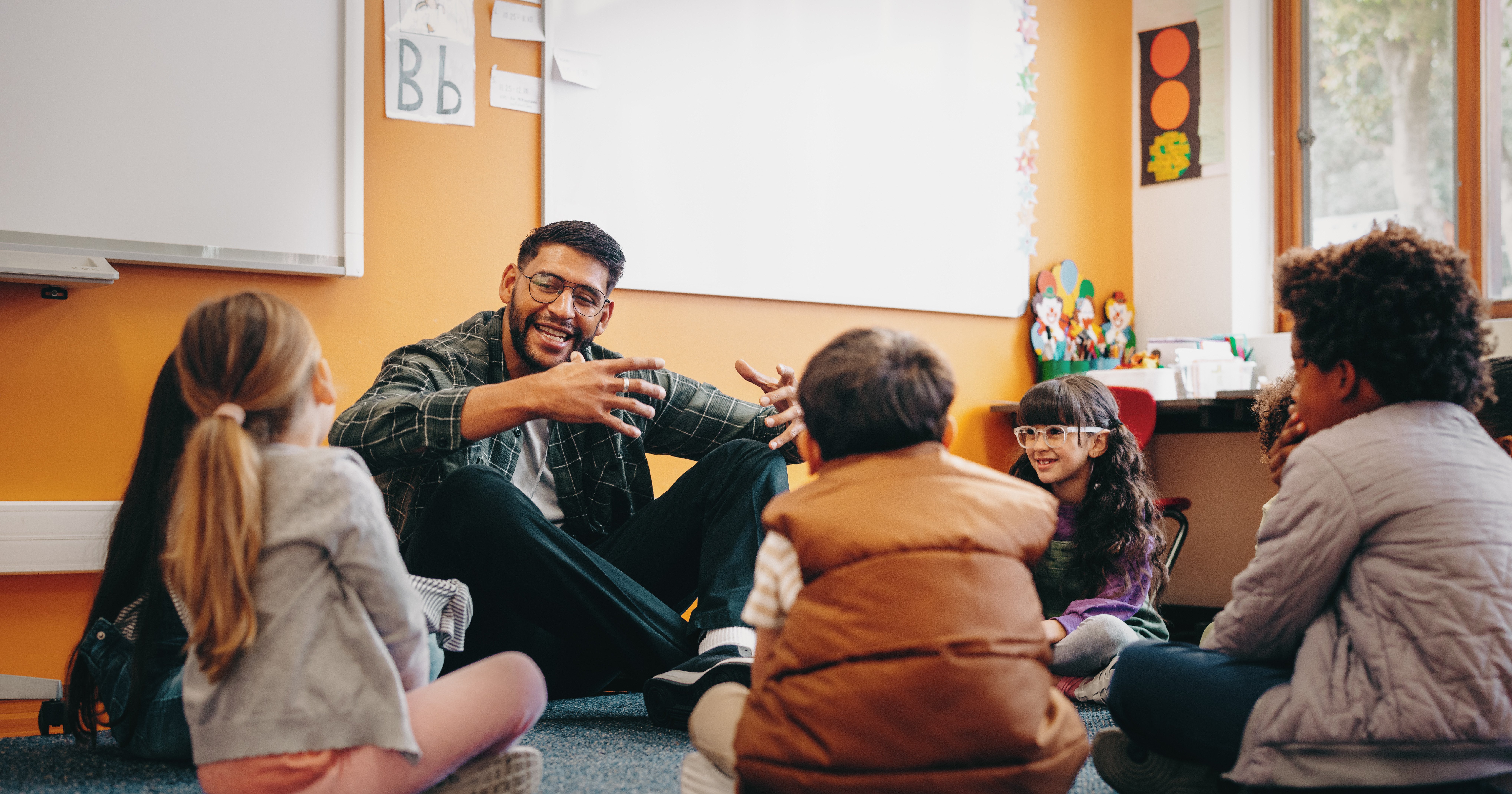 male teacher with young students